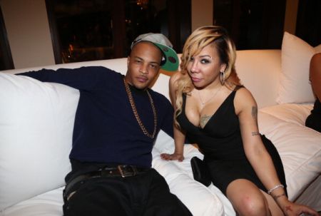 T.I. and wife Tiny pose for a picture.