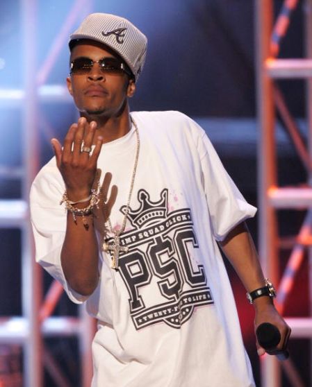T.I. performs at the BET Awards with a gray fitted, sideways.
