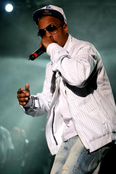 T.I. on stage performing. He couldn’t forget to turn that hat around.