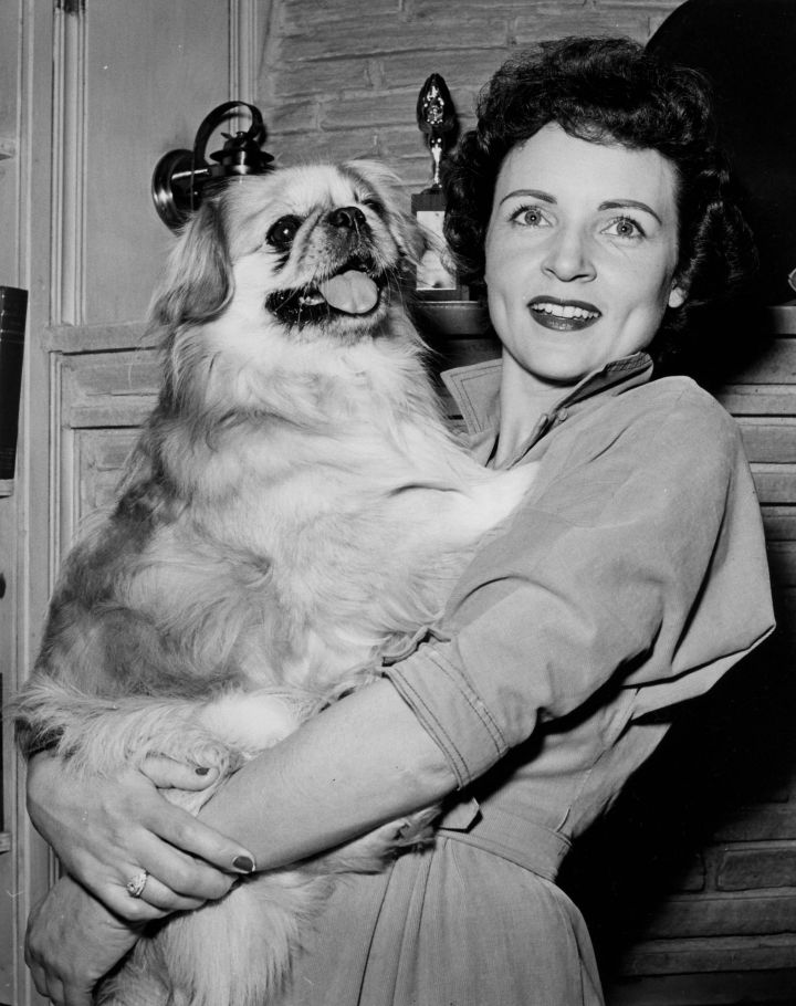 Betty White Loving Her Dog.