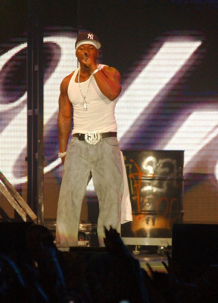 50 Cent performs in front of fans.