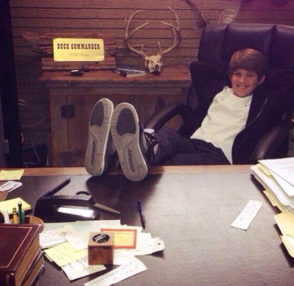 Future CEO kicking back in the corner-office