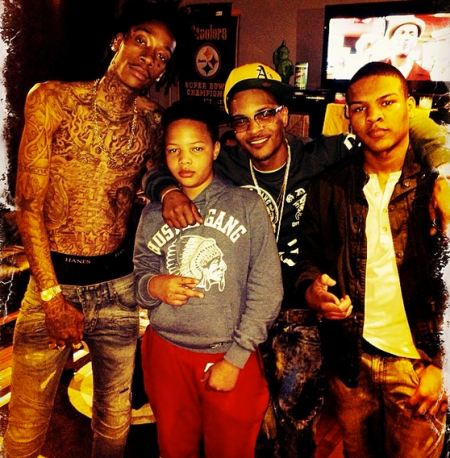 Wiz Khalifa, T.I. and his two kids in the studio.