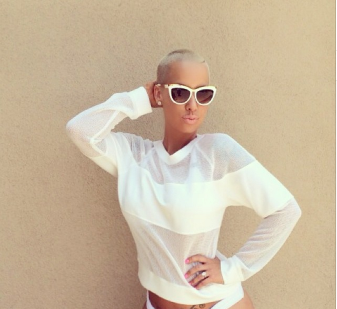 Amber Rose shows off some styles from a clothing line.