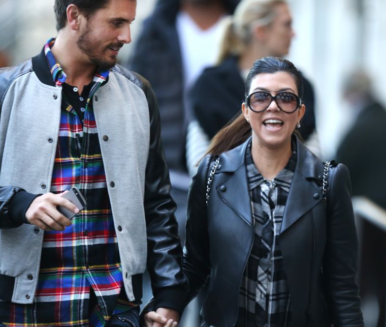 Kourtney laughs with Scott.