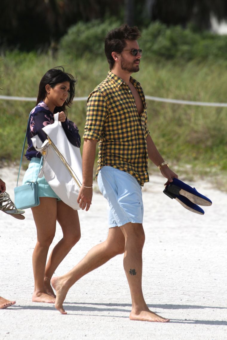 Scott and Kourtney walking on the beach.