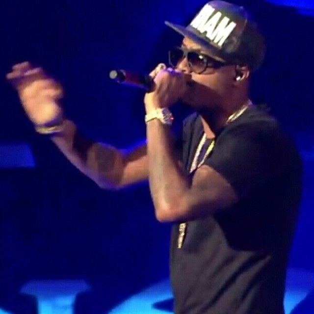 Nas hit the stage with a bottle of Henny.