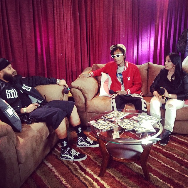 Wiz Khalifa stopped for interviews before his performance.