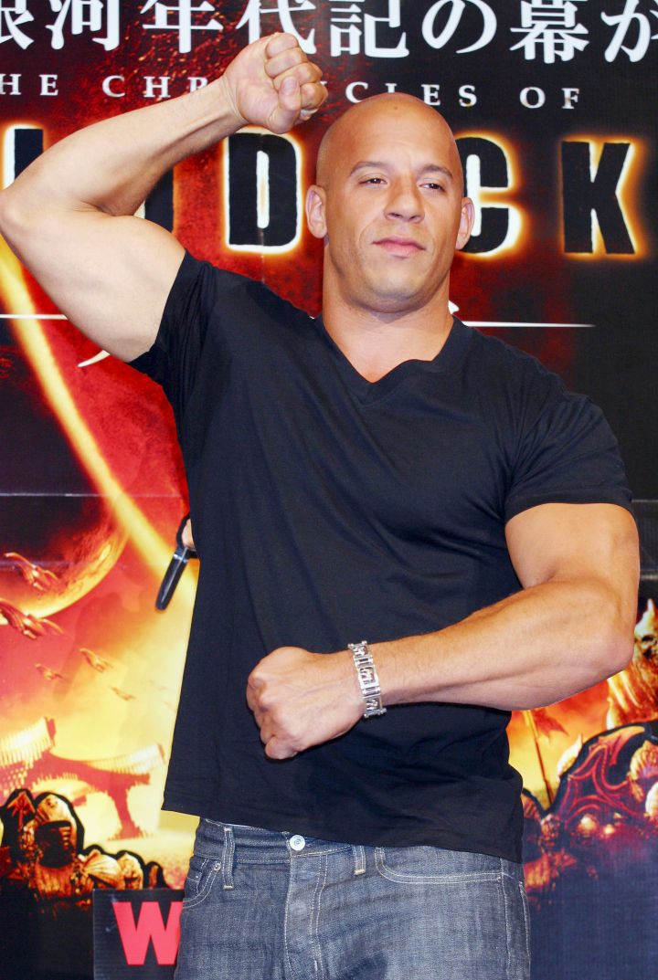 Vin Diesel gives us the gun show on the red carpet.