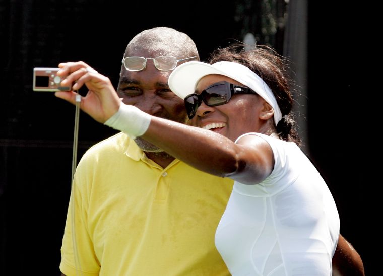 Venus takes a selfie with her dad in 2005.