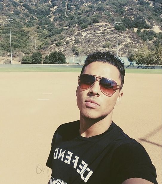 Quincy takes a selfie on the field before the game