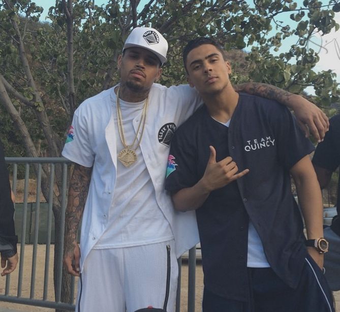 Chris Brown and Quincy prep before their competition