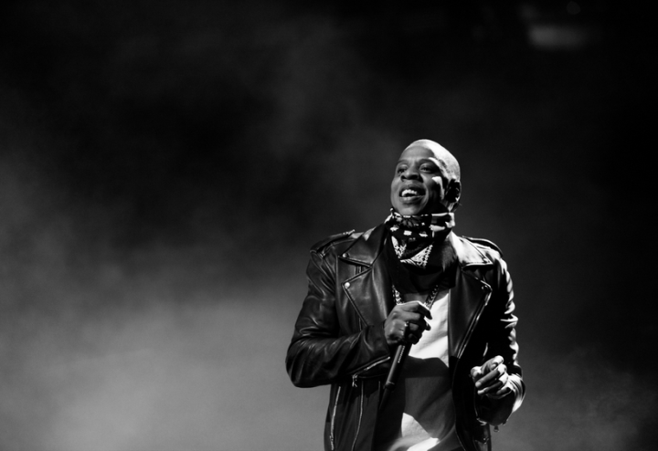 Jay Z flashes a smile while performing