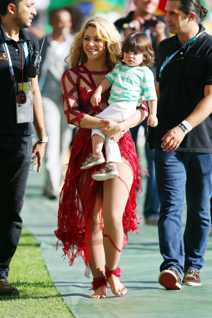 Shakira walks with son Milan after her closing ceremony performance at the FIFA World Cup.