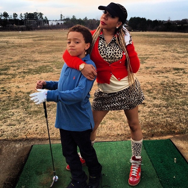 On the field with her boy.