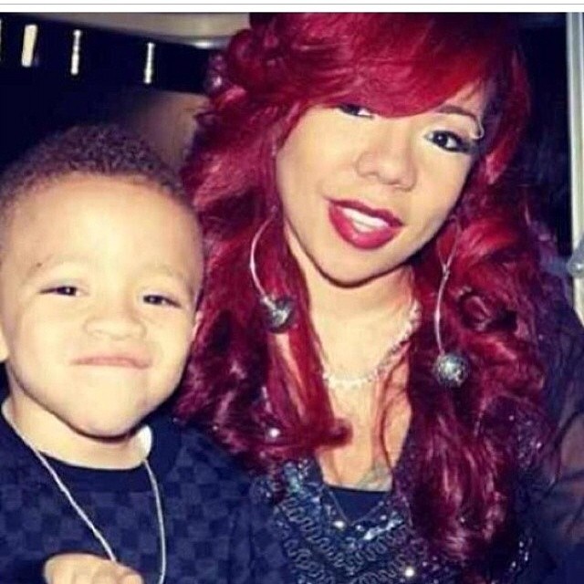 A red haired Tiny is all smiles with young King.