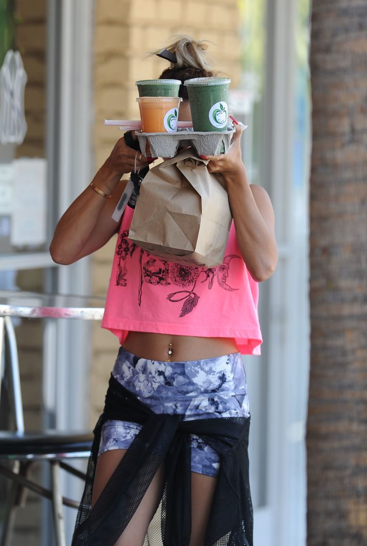Vanessa Hudgens hides behind her tray of smoothies after a workout in L.A.