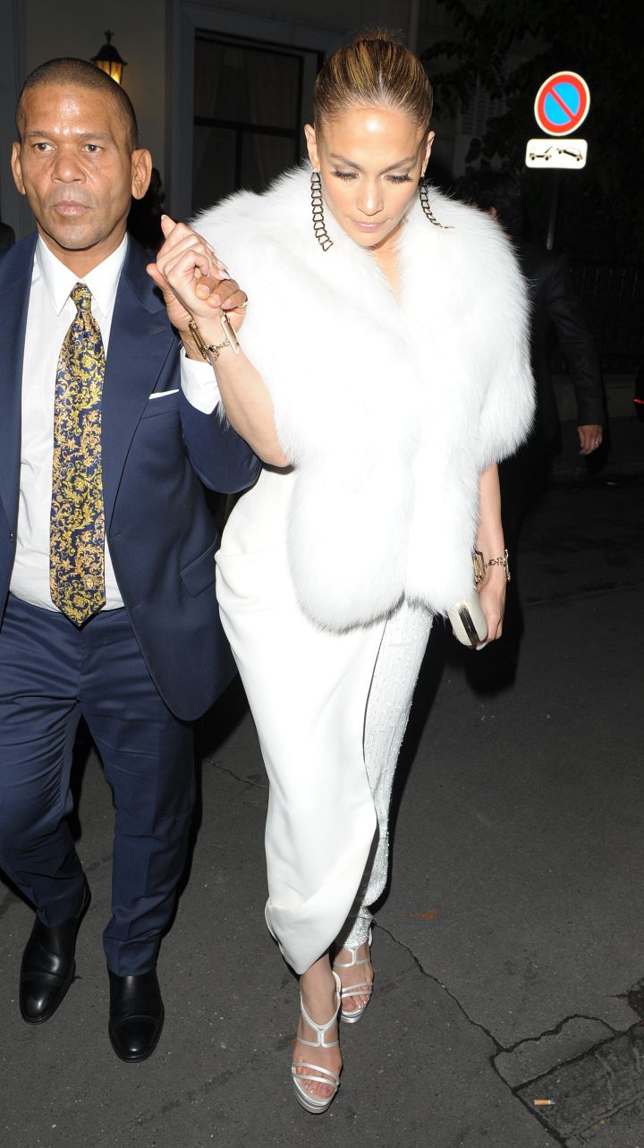 Jennifer Lopez is escorted by Benny Medina while leaving a restaurant in Paris.