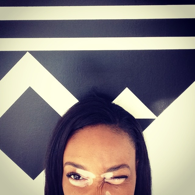 Half smize, half wink.