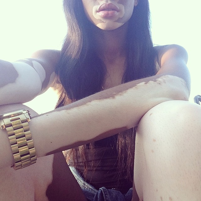 All gold on her wrist.