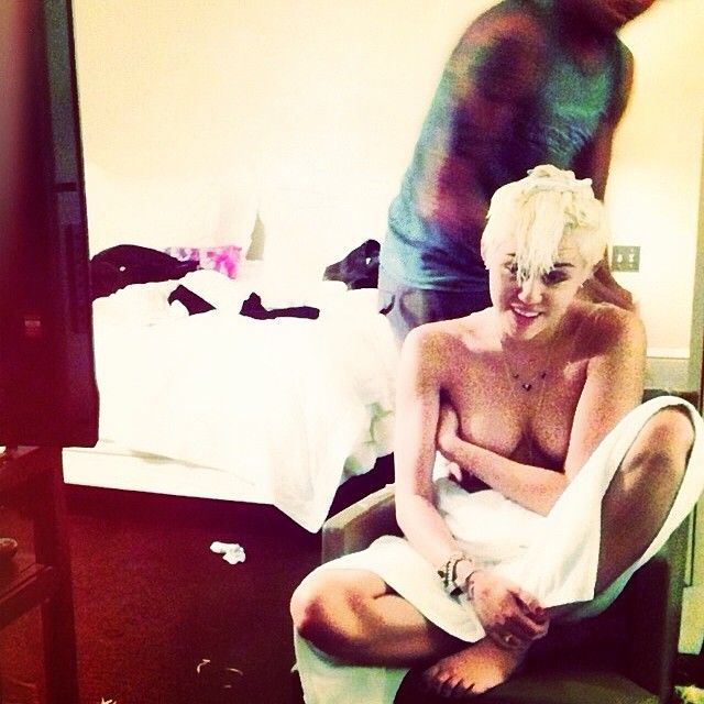 Posted topless in a towel.