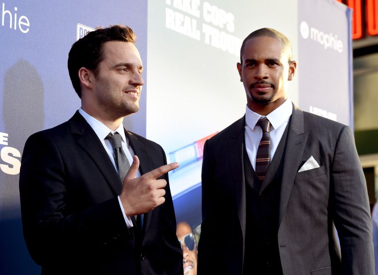 Jake Johnson and Damon Wayans Jr on the red carpet of the “Let’s Be Cops” Premiere in Los Angeles.