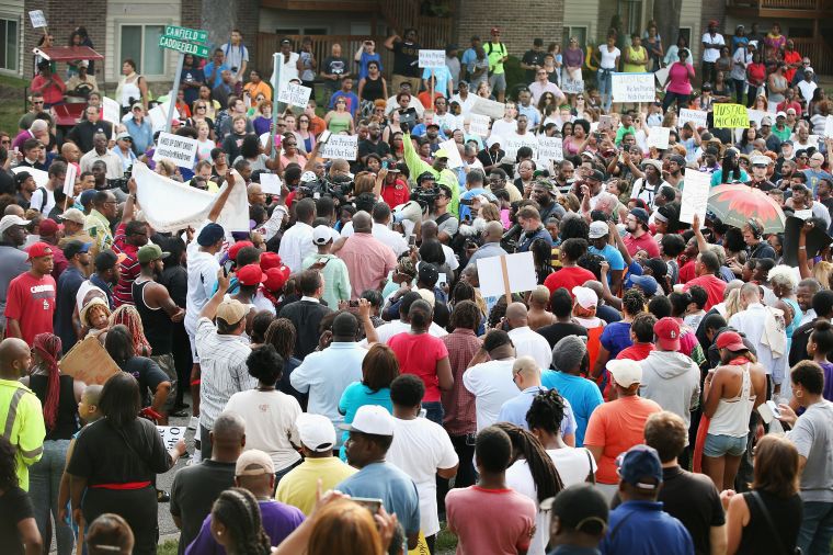 Crowds gather to protest the shooting of unarmed 18-year-old Michael Brown.
