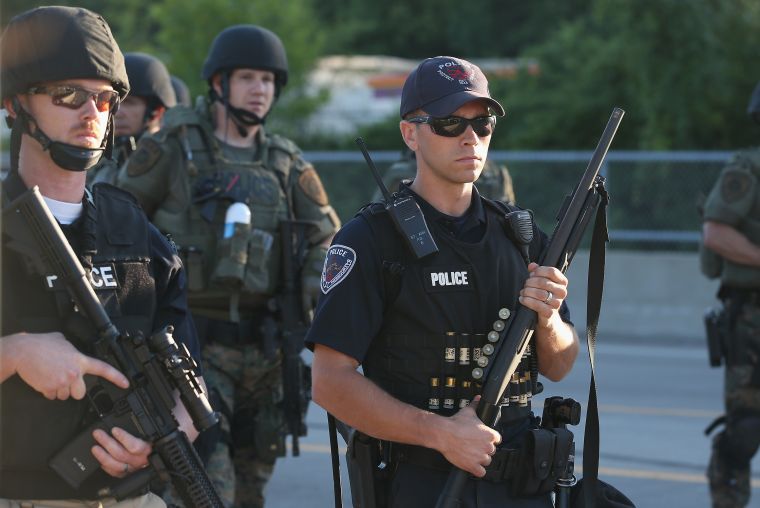 Police armed with rubber bullets during protest.