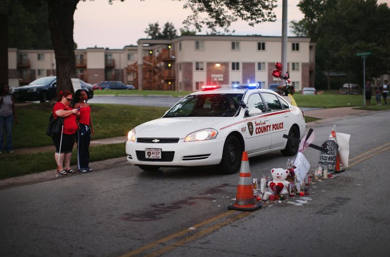 Memorial for Michael Brown stands in the middle of the street where he was gunned down.