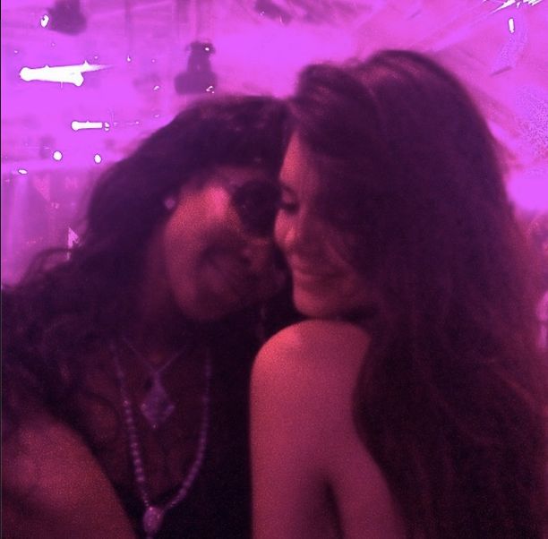 Kendall Jenner cozies up with a friend at the party