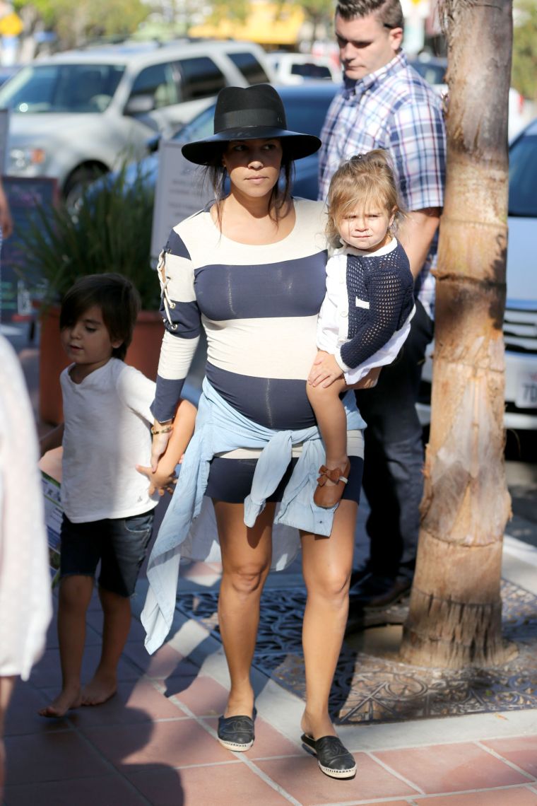 Penelope Disick gives the paps a mean mug while Kourt shows off her bump