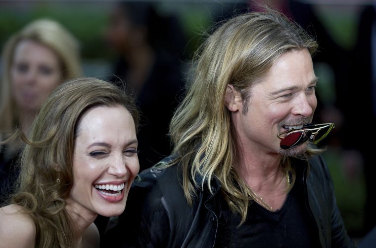 Nobody makes Angelina laugh like her hubby does.
