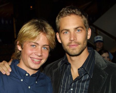 Walker poses with his younger brother Cody at the Los Angeles premiere of “Timeline.”