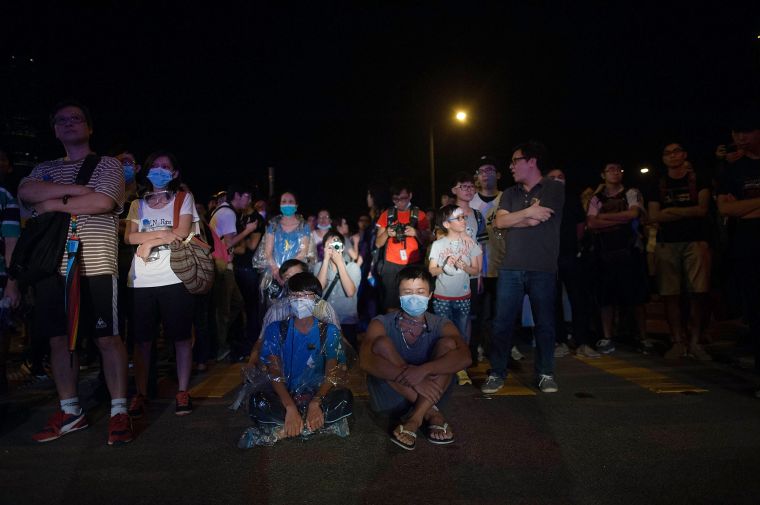 Thousands of pro democracy protestors unhappy with Chinese government’s plans to vet candidates in Hong Kong’s 2017 elections gather in the streets to demonstrate.