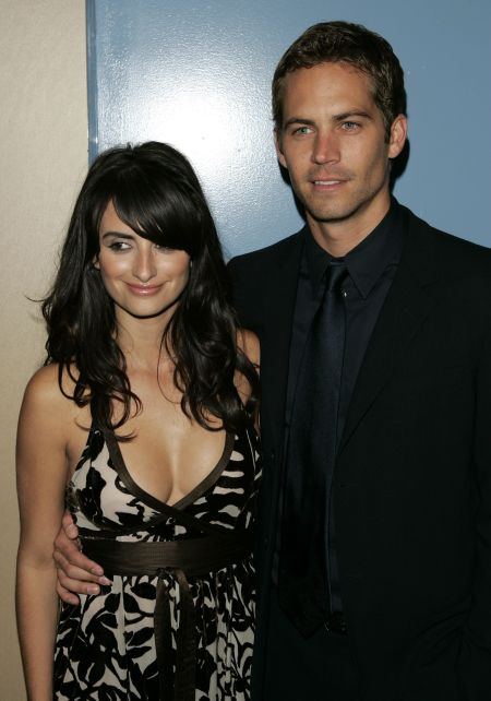 Penelope Cruz and Paul pose for cameras at the premiere of the film “Noel” in 2003.