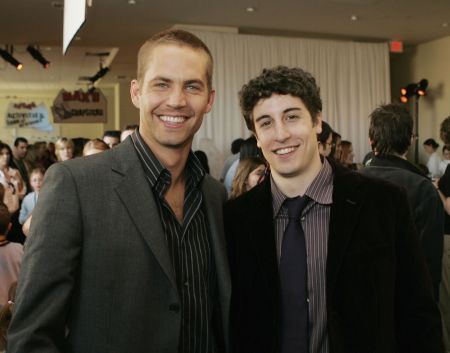 Walker poses with Jason Biggs at the 2006 premiere of “Eight Below.”