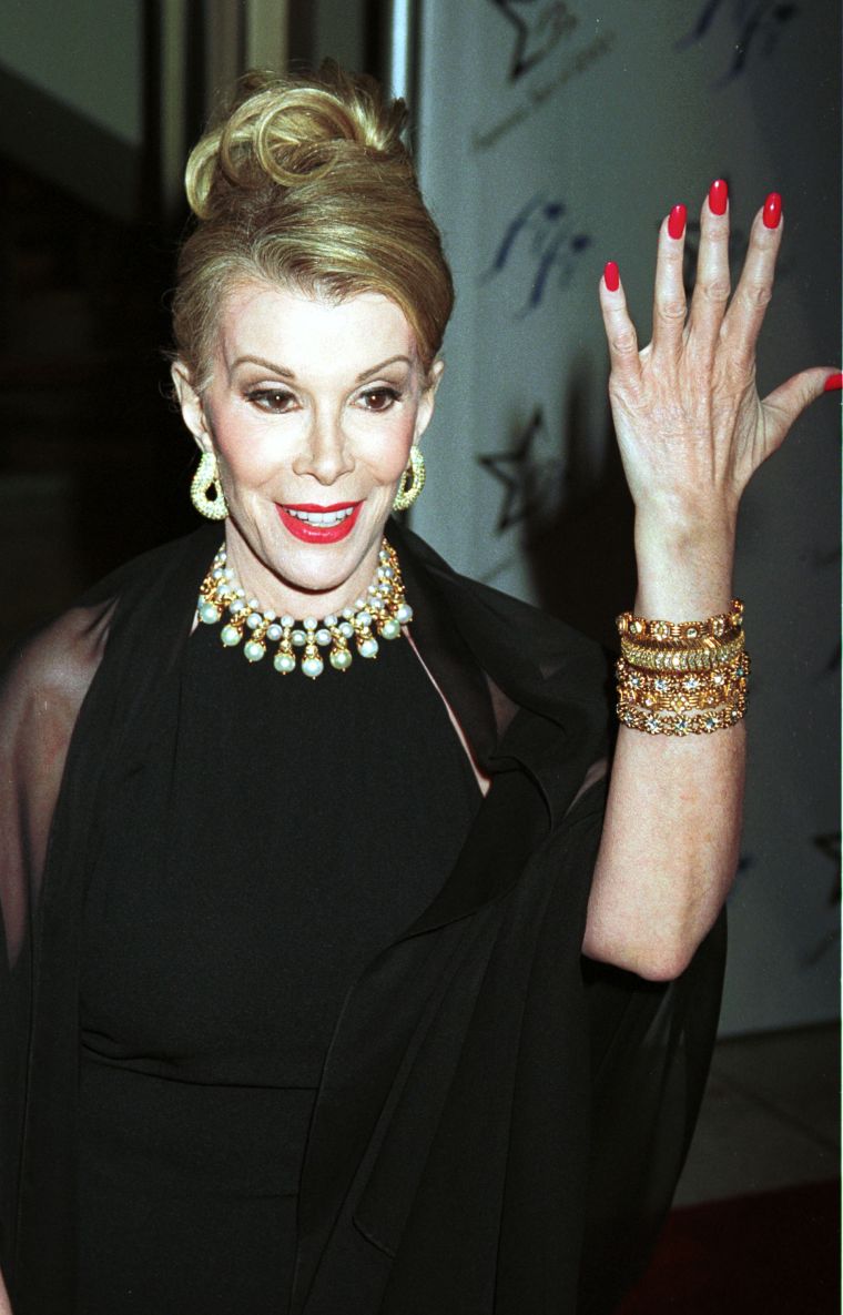 Rivers flashes her freshly manicured nails at the 28th Annual FiFi awards in 2000.