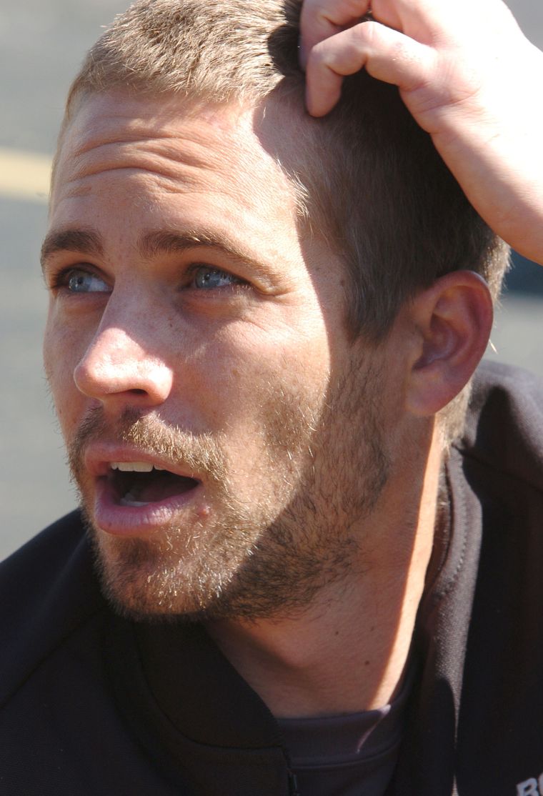 A photographer catches Paul intensely watching the races at the 3rd Annual Cadillac Super Bowl Grand Prix in 2005.