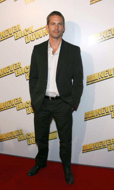 Walker sports a fitted black suit for the 2008 premiere of “Never Back Down.”