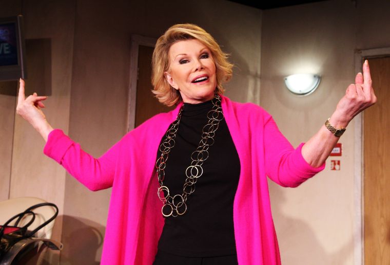 Rivers let her middle fingers fly during a 2008 photocall.