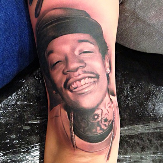 Amber made her love for Wiz super official when she got this massive tattoo of his face in 2012.