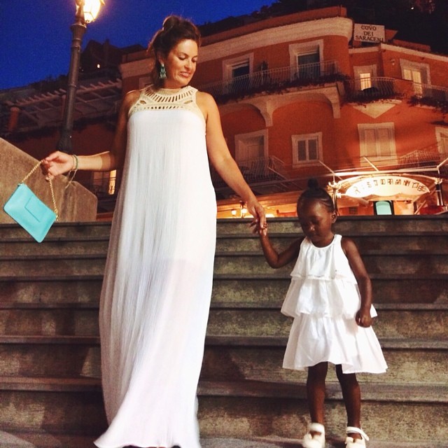 Mommy and daughter in all white.