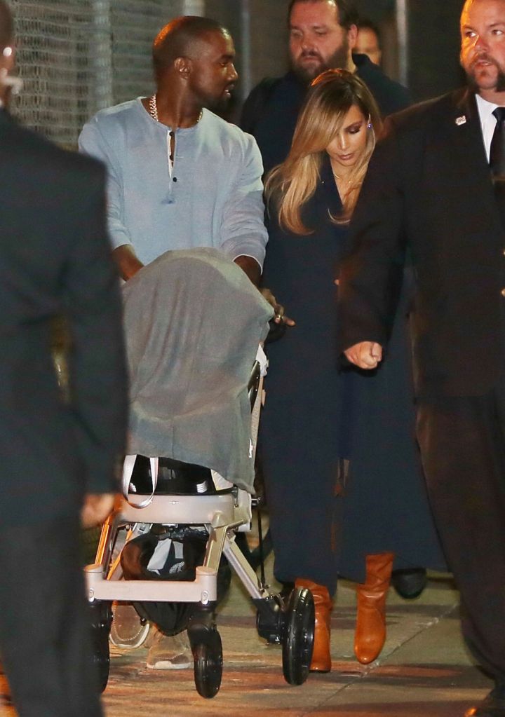 Kanye West pushing a stroller.