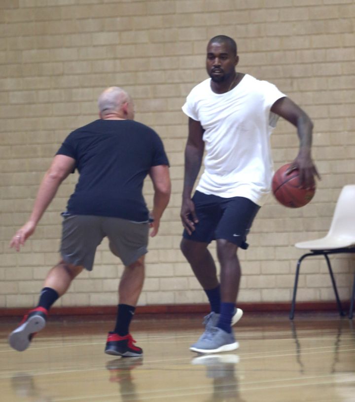 Kanye West playing basketball.