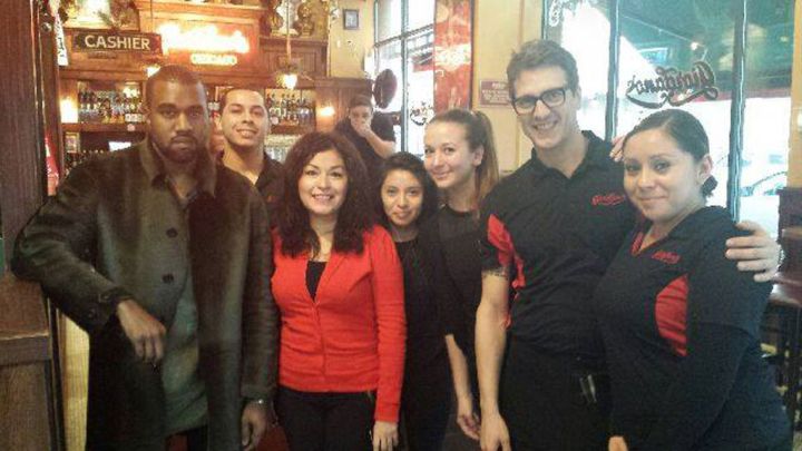 Kanye West eating Chicago-style pizza.