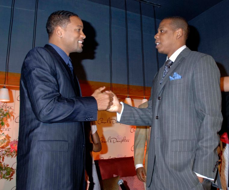 Suited up! Will talks business with Jay Z.