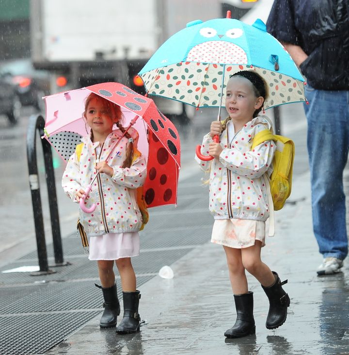 Twinsies. Marion and Tabitha Broderick were seen heading to school in the rain wearing matching outfits.