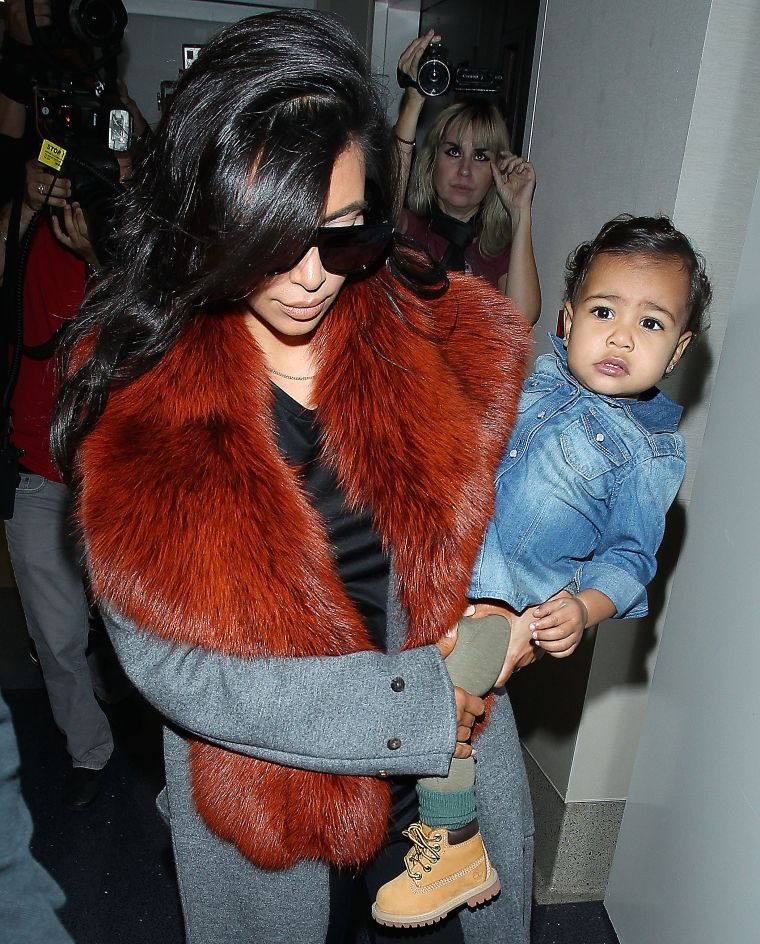 North sat pretty on her mom’s hip back in September when she wore this adorable little denim top.