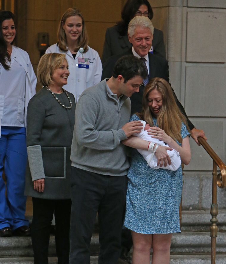 Chelsea Clinton, her husband Marc Mezvinsky, and her parents President Bill Clinton and Hillary Clinton leave Lenox Hill Hospital with newborn Charlotte in New York City.