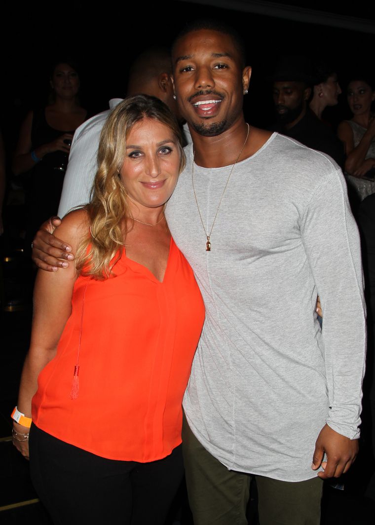 Michael B. Jordan and Nicole Fogel take advantage of a photo op during a charity event.